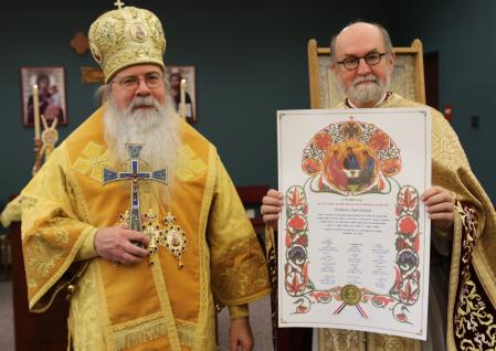 His Beatitude, Metropolitan Tikhon presents a gramata from the Holy Synod of Bishops of the Orthodox Church in America to Fr. Chad Hatfield, on the occasion of Fr. Chad's 40 years of ordained ministry.